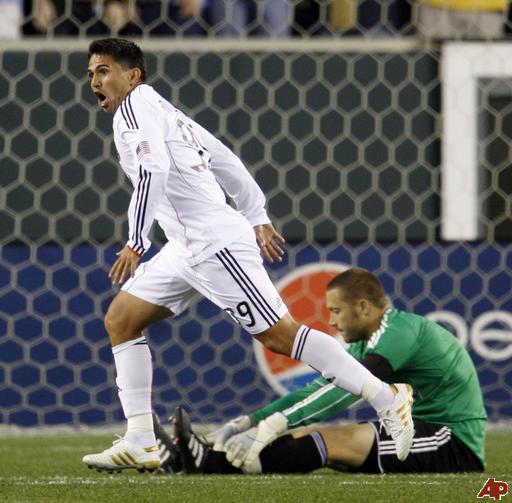 Jaime Moreno celebrates after scoring past Chris Seitz