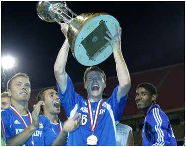2004 Kansas City Wizards Hold Their “Best Ever Team” Trophy (Resemblance to U.S. Open Cup merely coincidental)