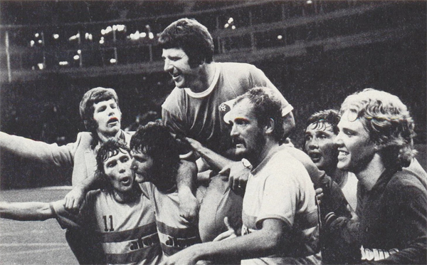 Jubilant Atoms players carry coach Al Miller after the win. Photo courtesy nasljerseys.com.