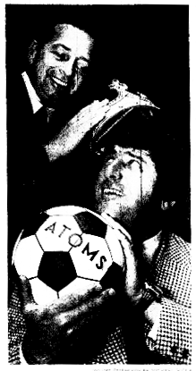 Bob Ehlinger crowns Al Miller as Coach of the Year.